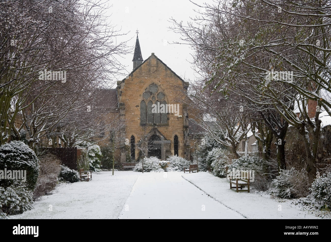 Small church and driveway covered in snow Stock Photo