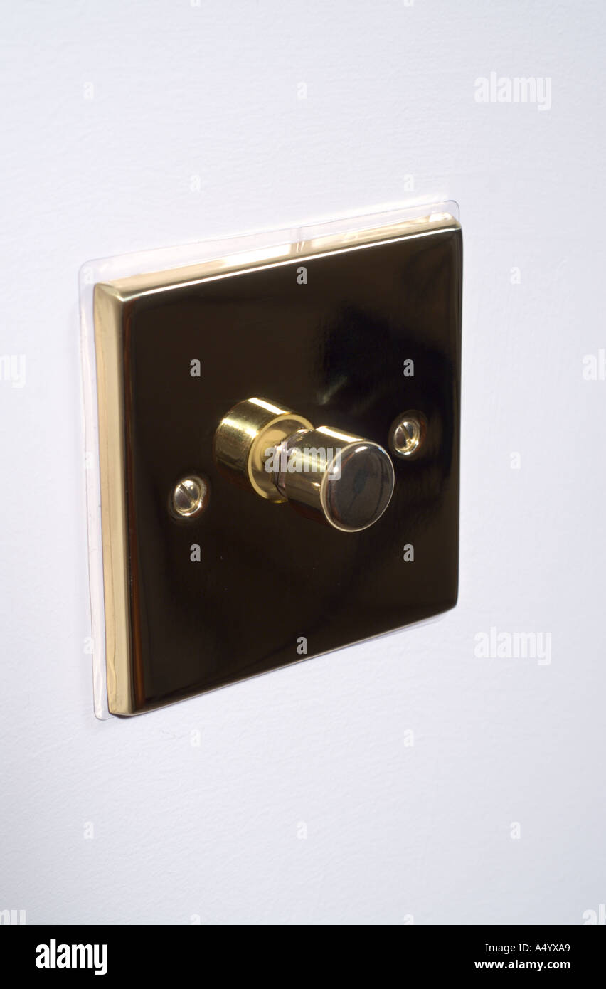 Brass dimmer electric light switch Stock Photo