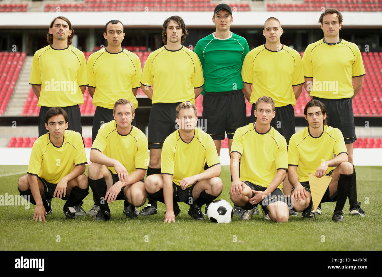 Football team in yellow Stock Photo