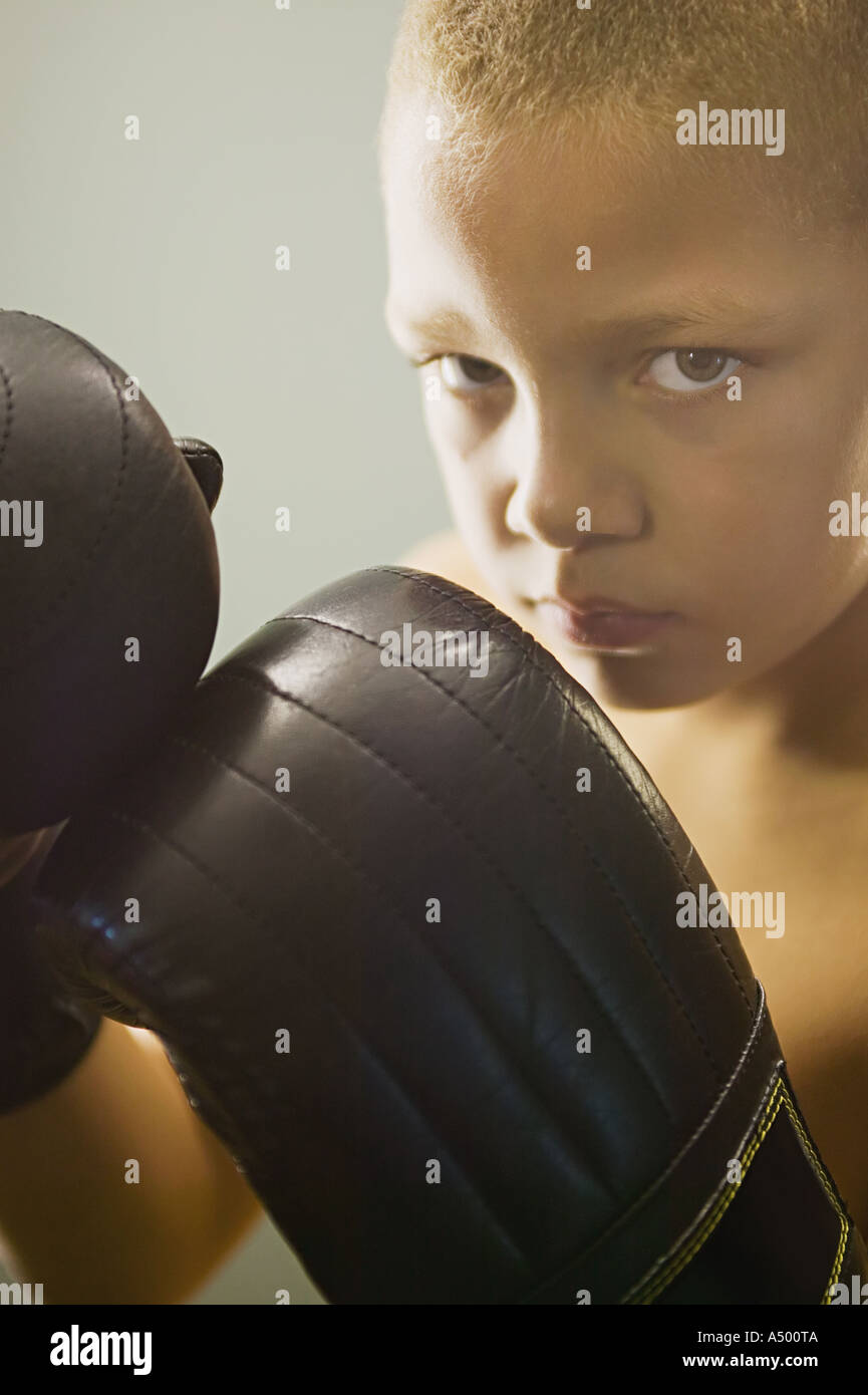Boy wearing boxing gloves Stock Photo Alamy