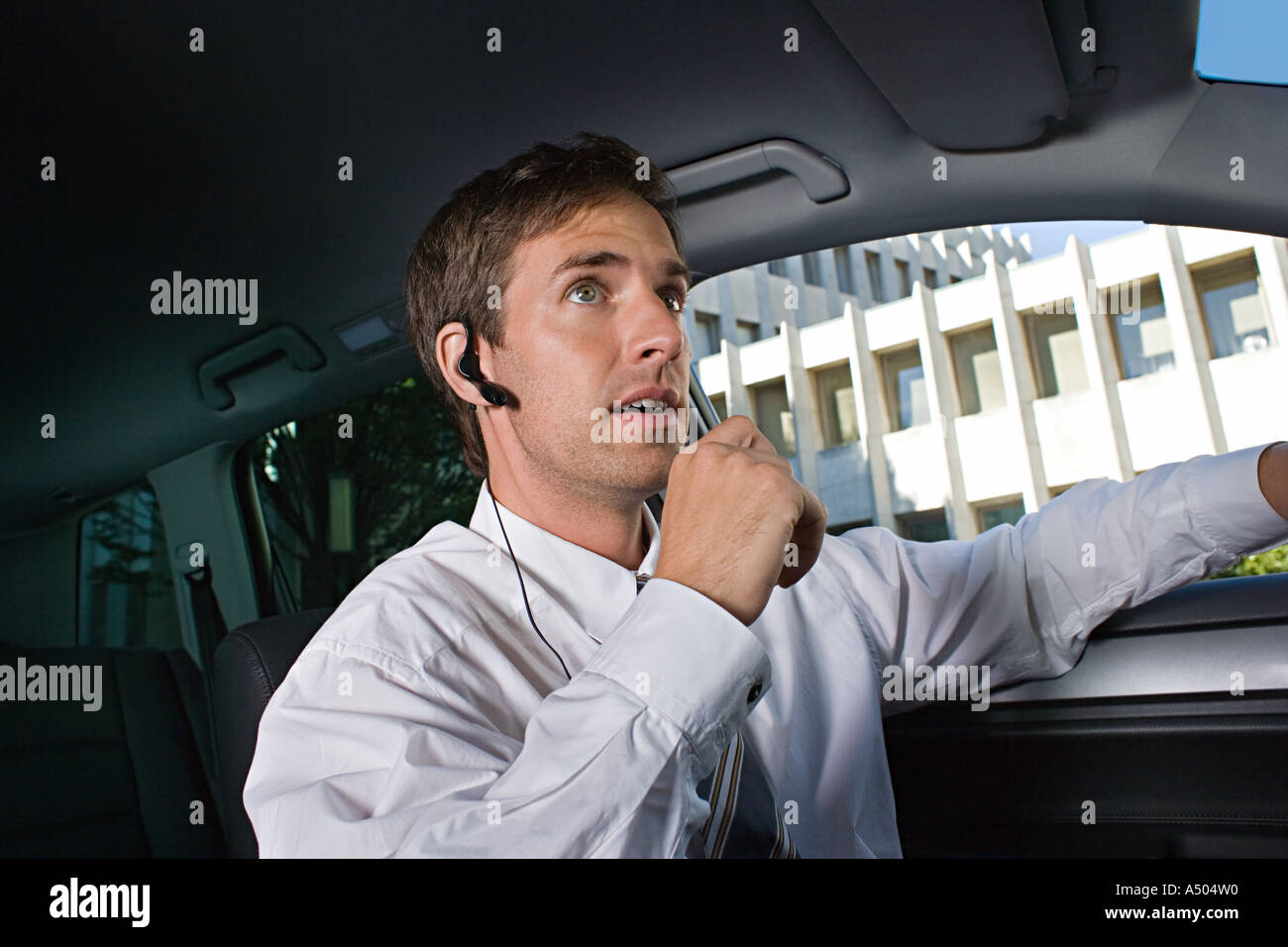 Man using hands free kit Stock Photo Alamy