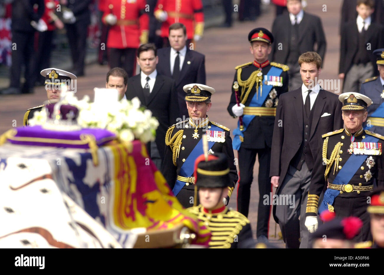 Prince Charles and Prince William march solemnly behind the Queen Mothers coffin during her funeral procession Stock Photo