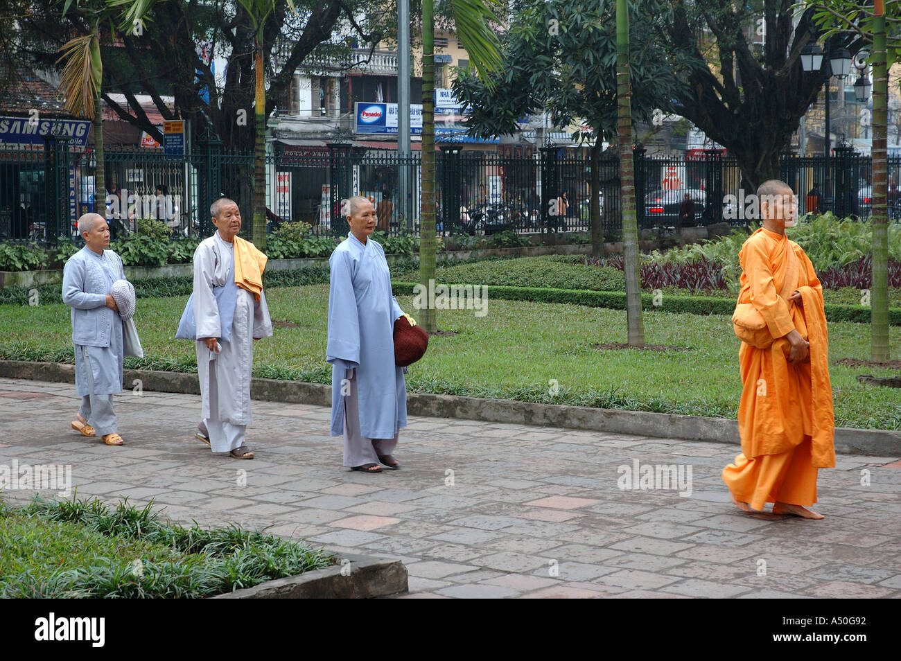 Temple of Literature built 1070 Hanoi Vietnam South East Asia Parade of  Buddhist monks and nuns in saffron and blue robes Stock Photo - Alamy