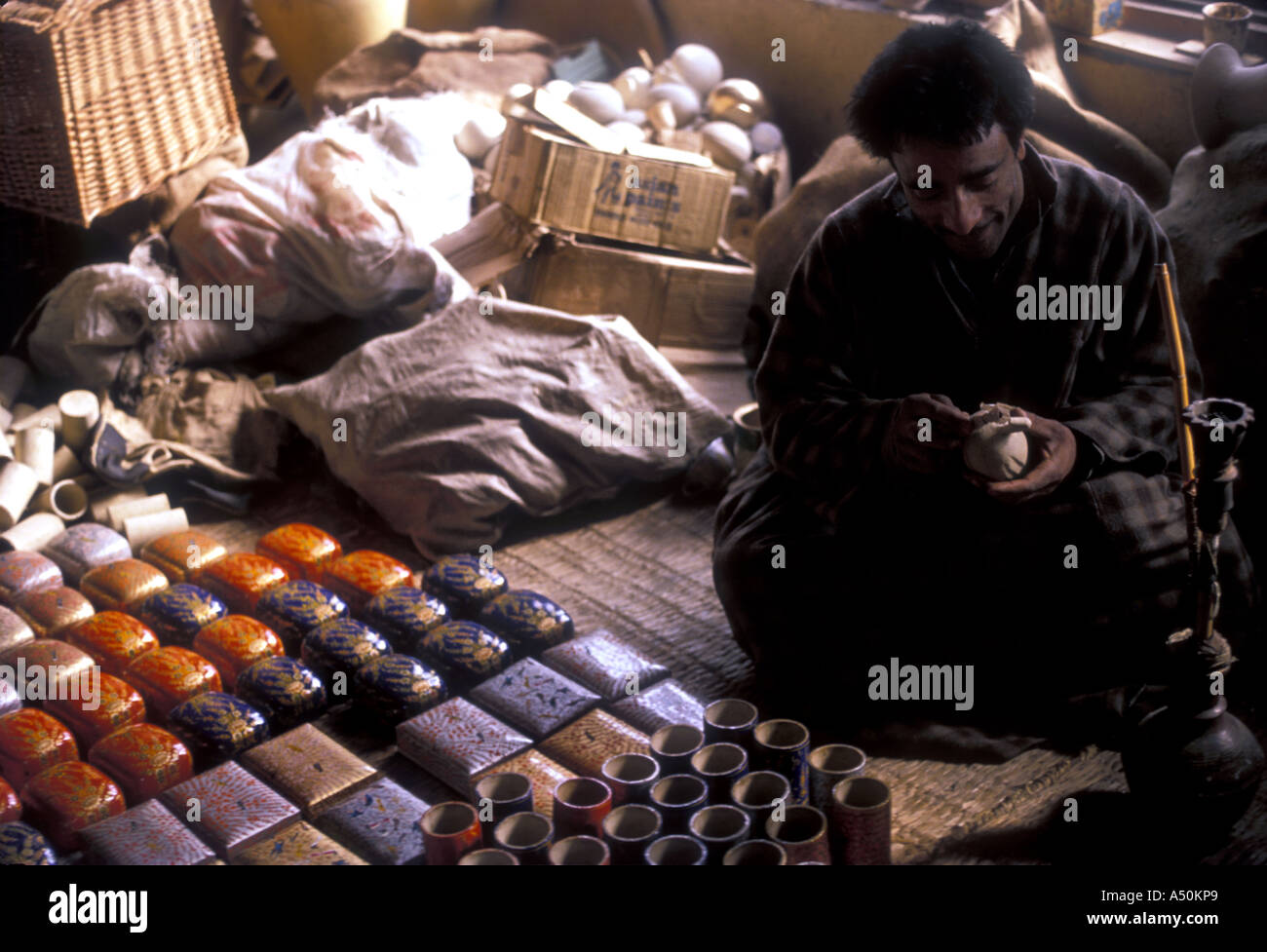 Kashmiri craftsman painting paper mache Stock Photo Alamy