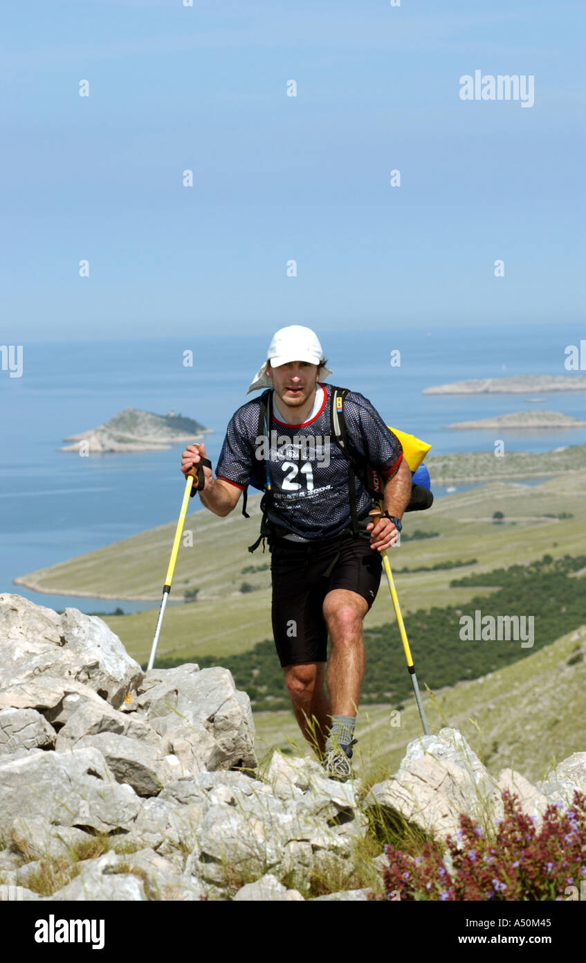 Adventure race athlete trekking in mountains on croatia islands Stock Photo