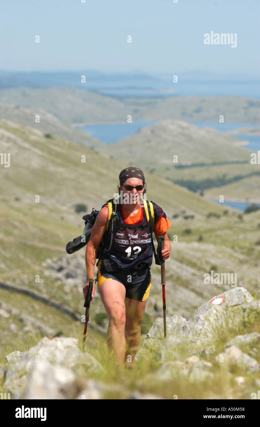Adventure race athlete trekking in mountains on croatia islands Stock Photo