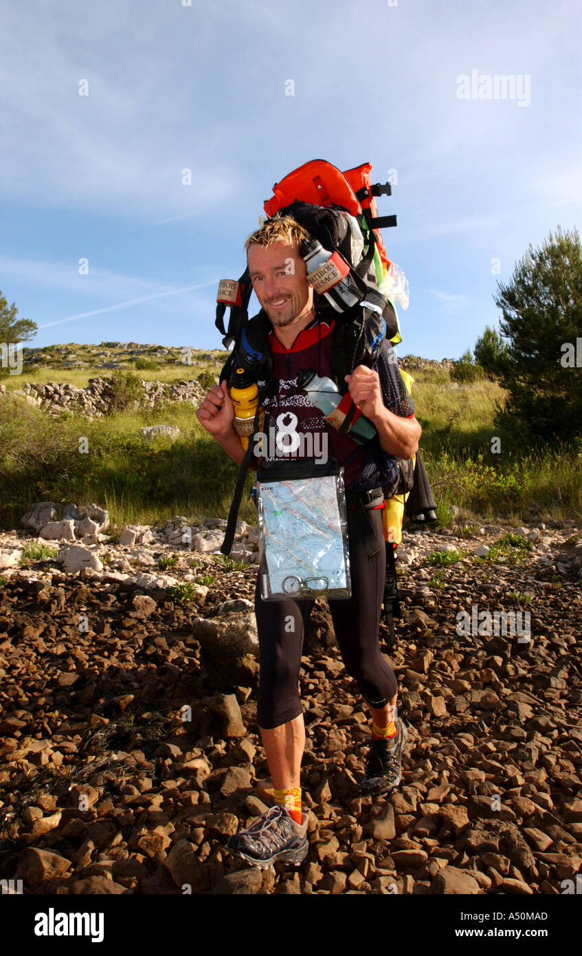Adventure race athlete with large pack Stock Photo Alamy
