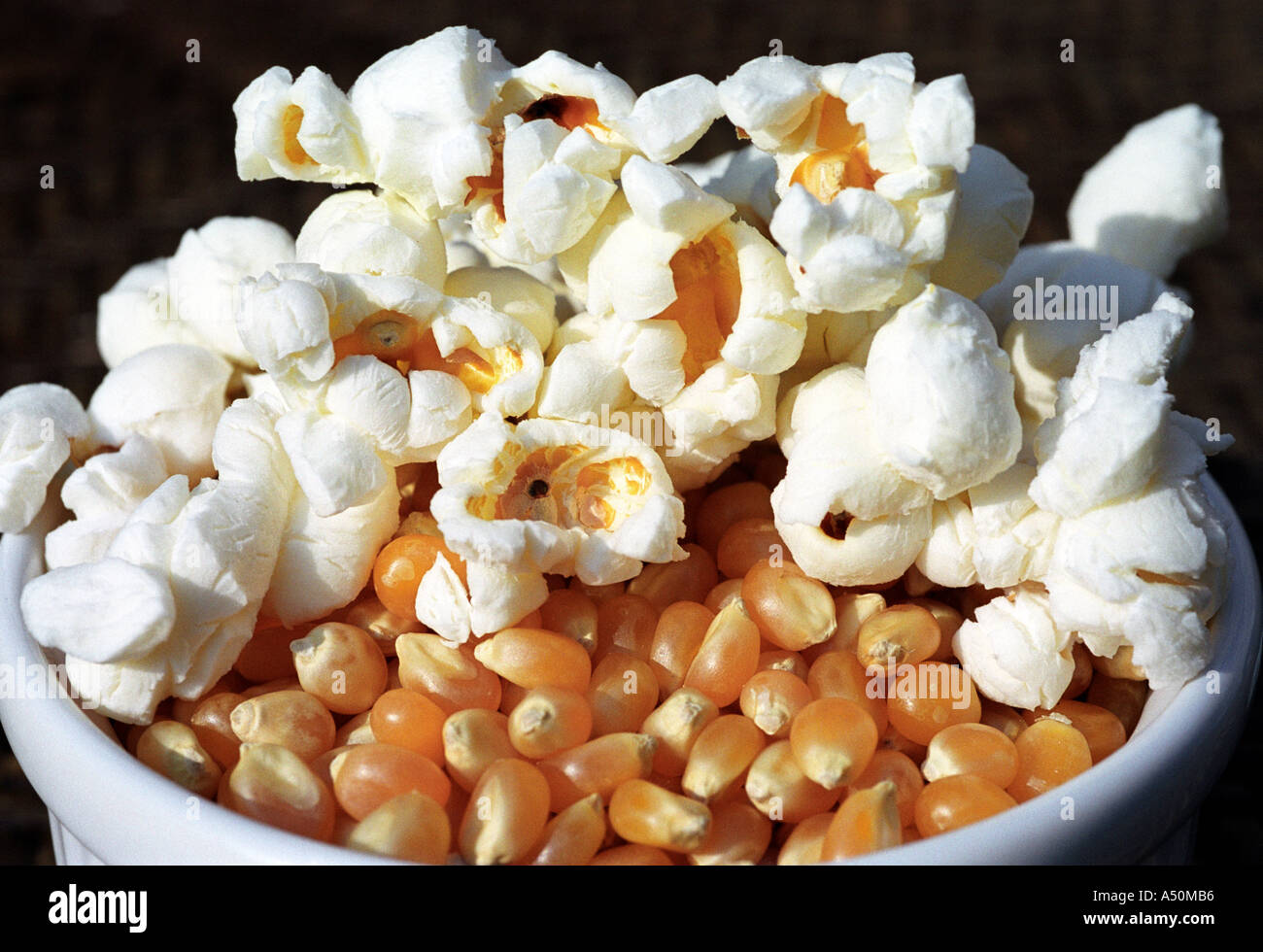 Unpopped and popped pop corn Stock Photo - Alamy