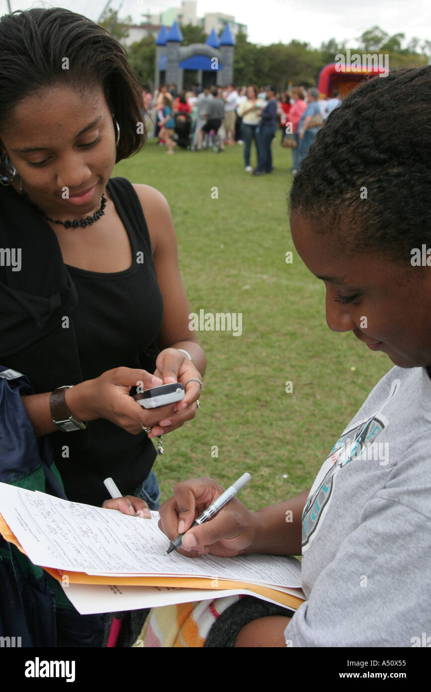Miami Beach Florida,North Shore Park,Parks and Recreation Department Youth Expo,Black Blacks African Africans ethnic minority,females,survey petitionf Stock Photo