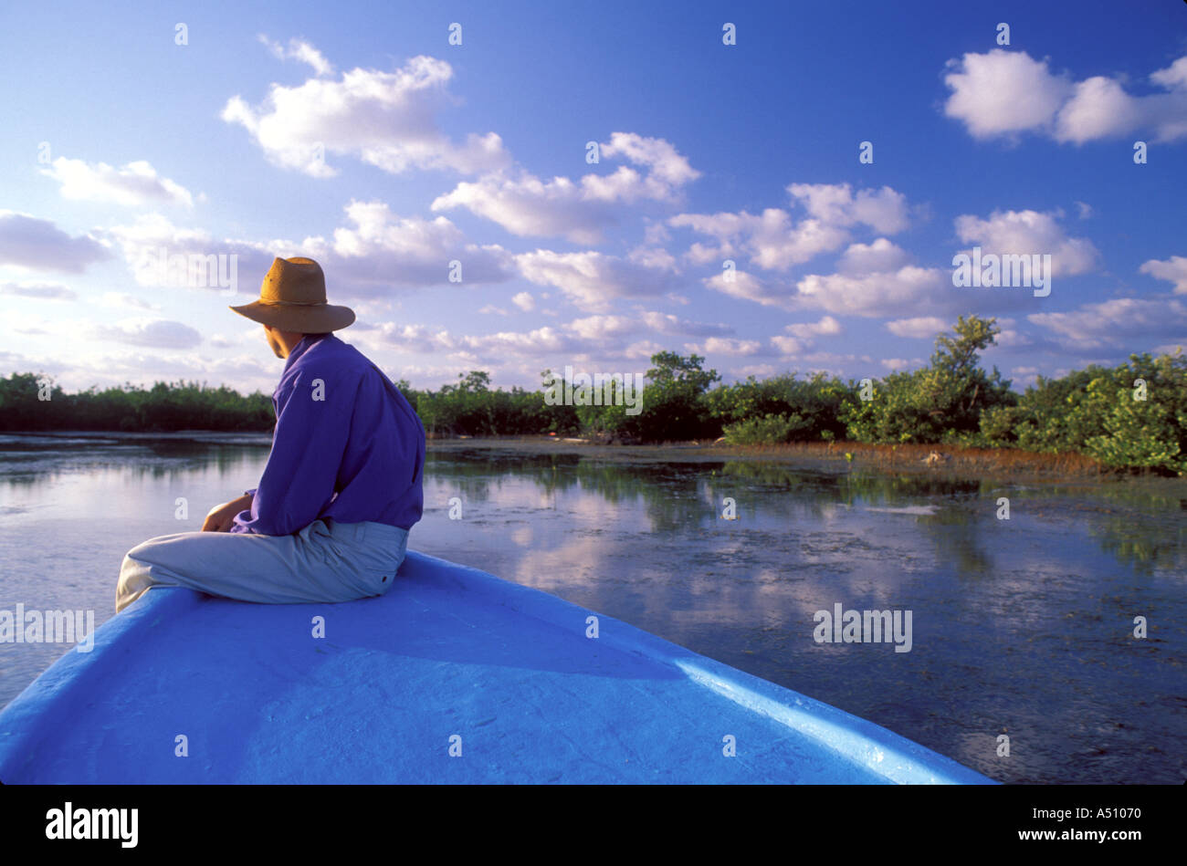 Man riding on bow while traveling by boat on the island of Cozumel in Quintana Roo Mexico Stock Photo