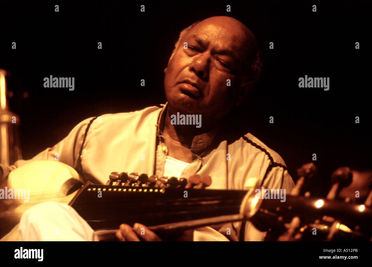 Indian classical musicians Ustad Ali Akbar Khan playing Sarod Stock