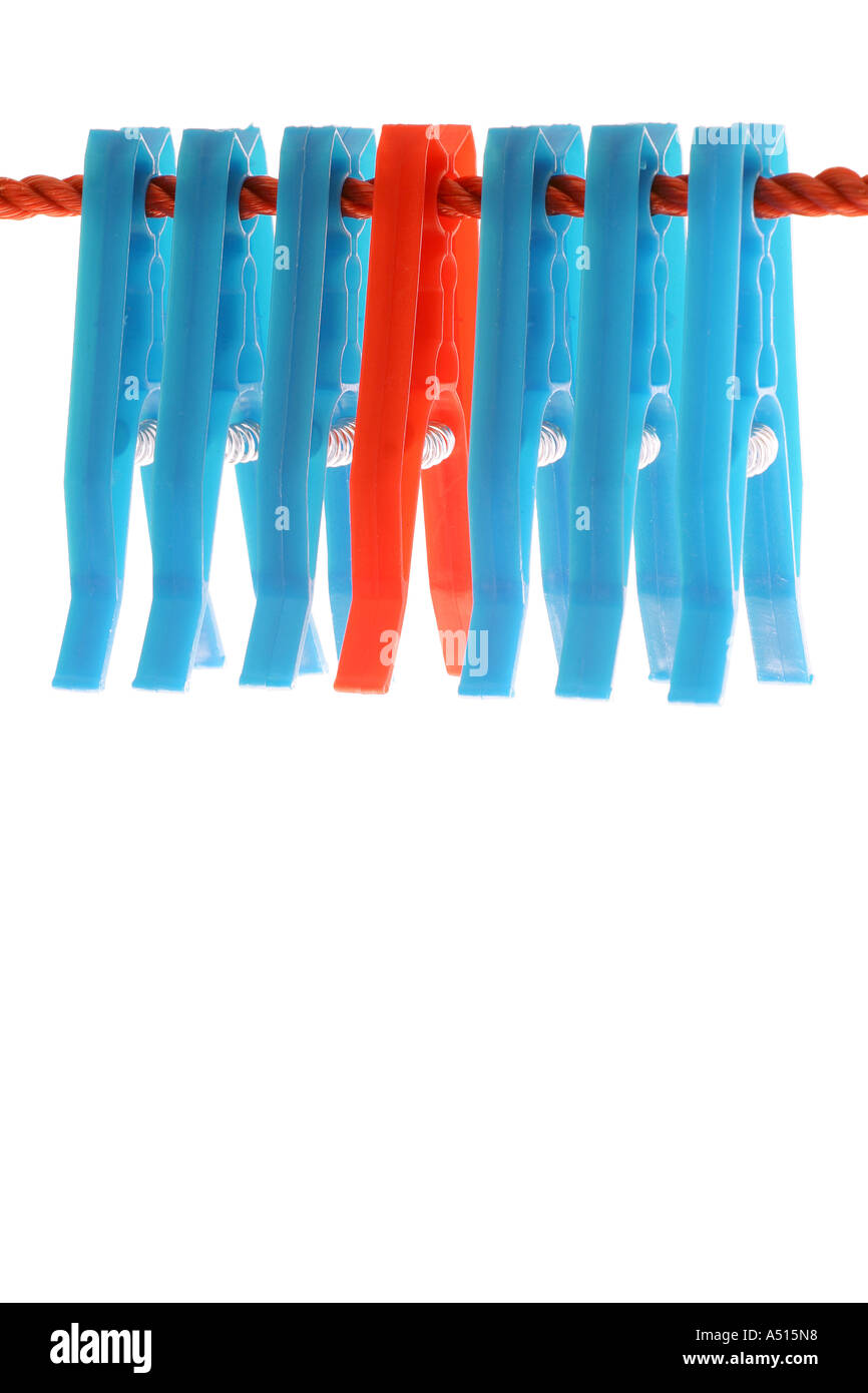 Clothes pegs pegged to a red clothes line on a white background Stock Photo Alamy