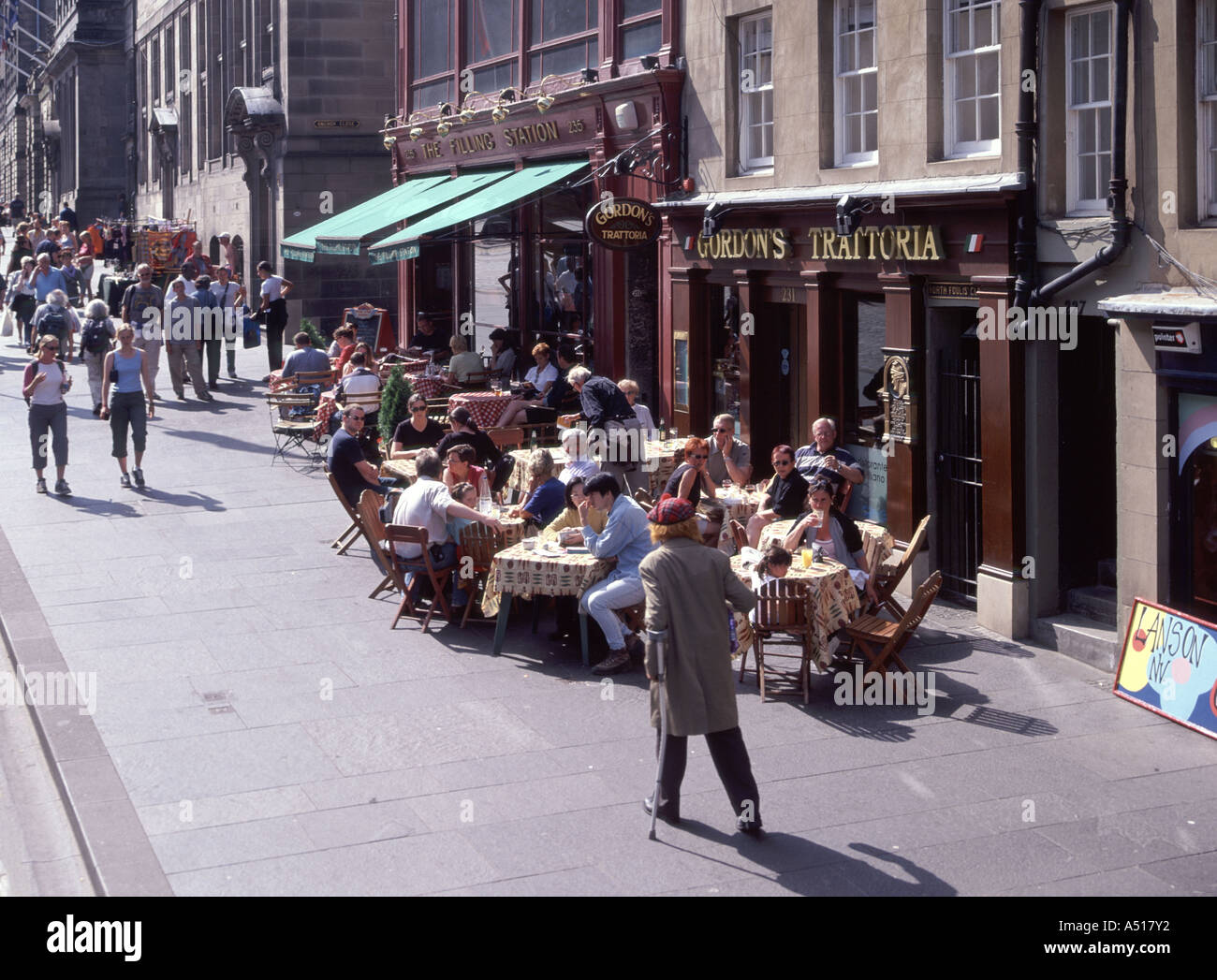 Royal Mile also known as the High Street view of several touristy eating houses with pavement bar and pedestrians Old Town Edinburgh Scotland UK Stock Photo