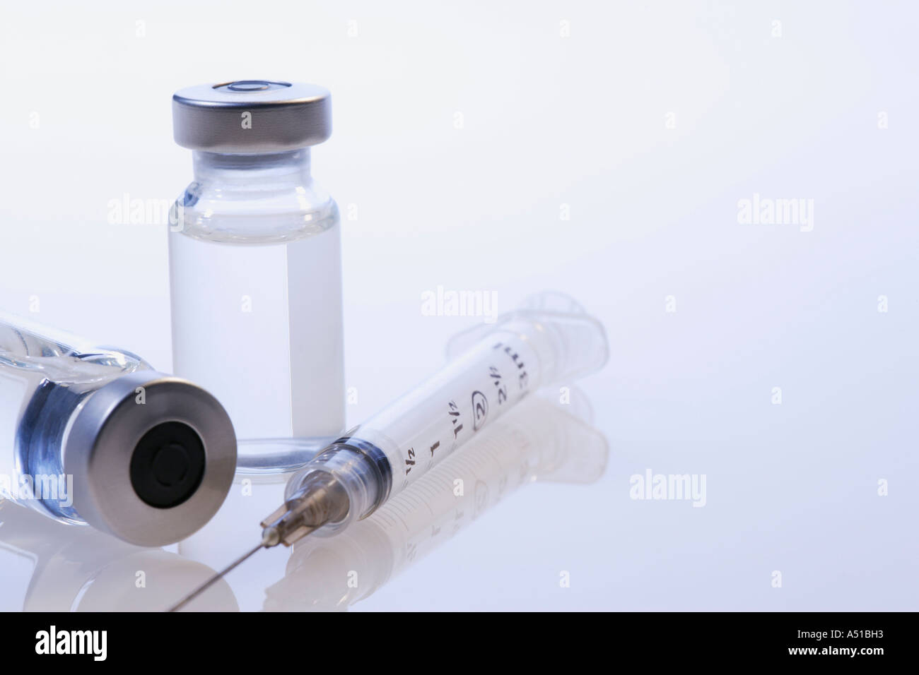 Closeup of syringe and vials Stock Photo