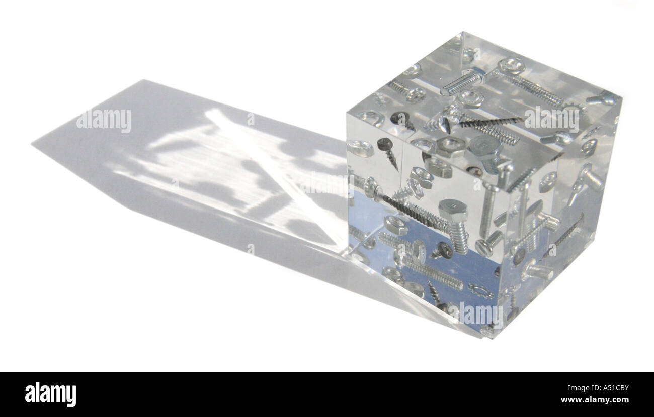 Lucite paperweight with suspended nuts and bolts Stock Photo Alamy