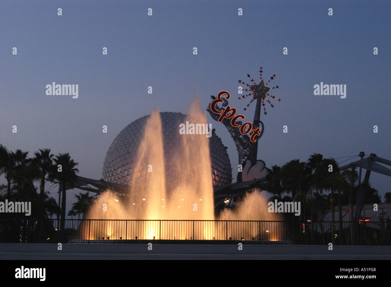 Epcot Walt Disney World Orlando spaceship earth spotlit fountain at twilight Stock Photo