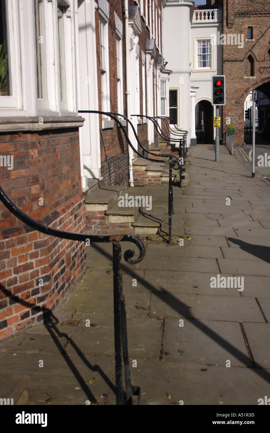 Traditional houses in front of the medieval walled gateway at