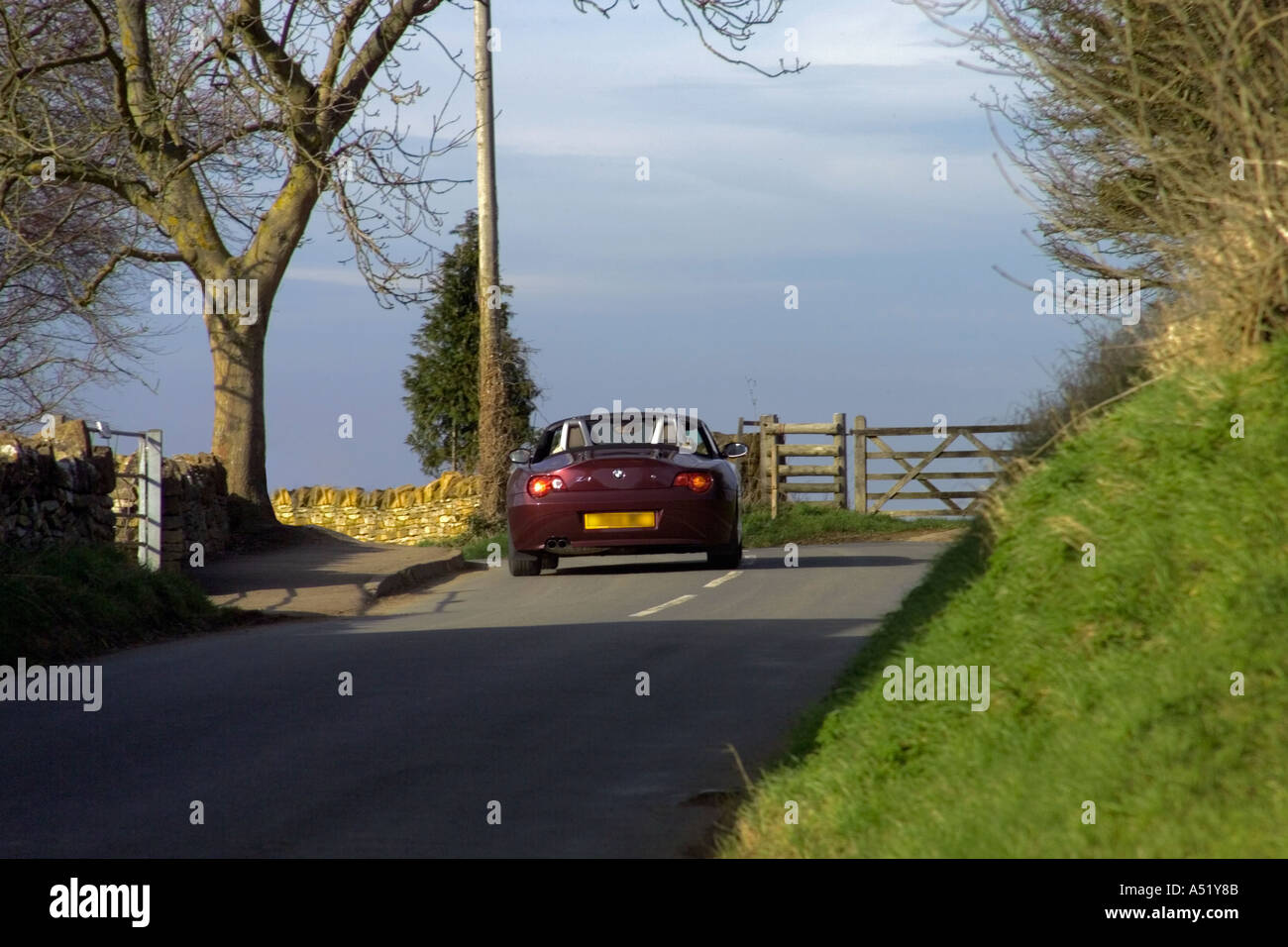 england gloucestershire the cotswolds car driving along cotswolds lane