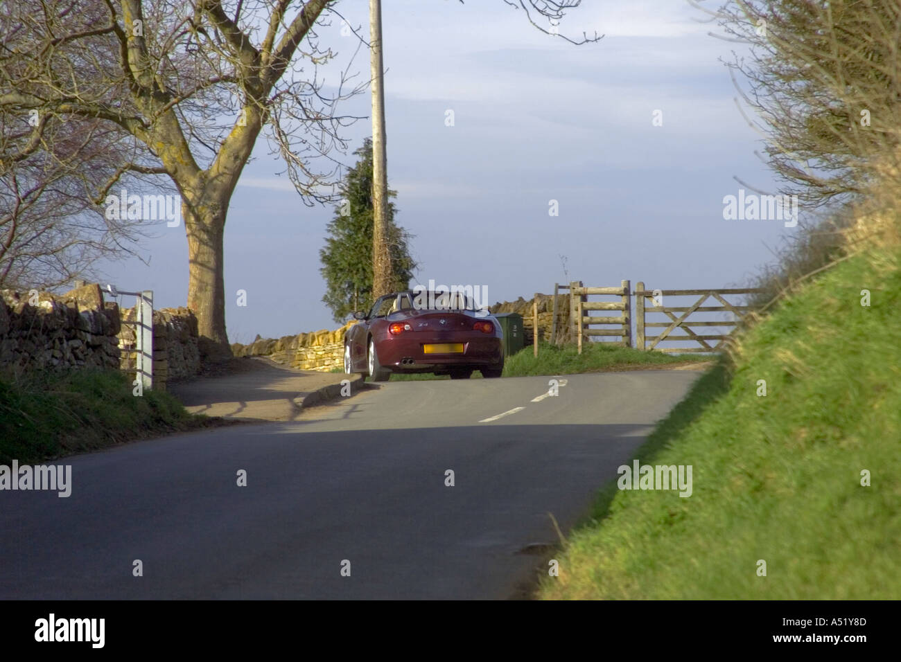 england gloucestershire the cotswolds car driving along cotswolds lane