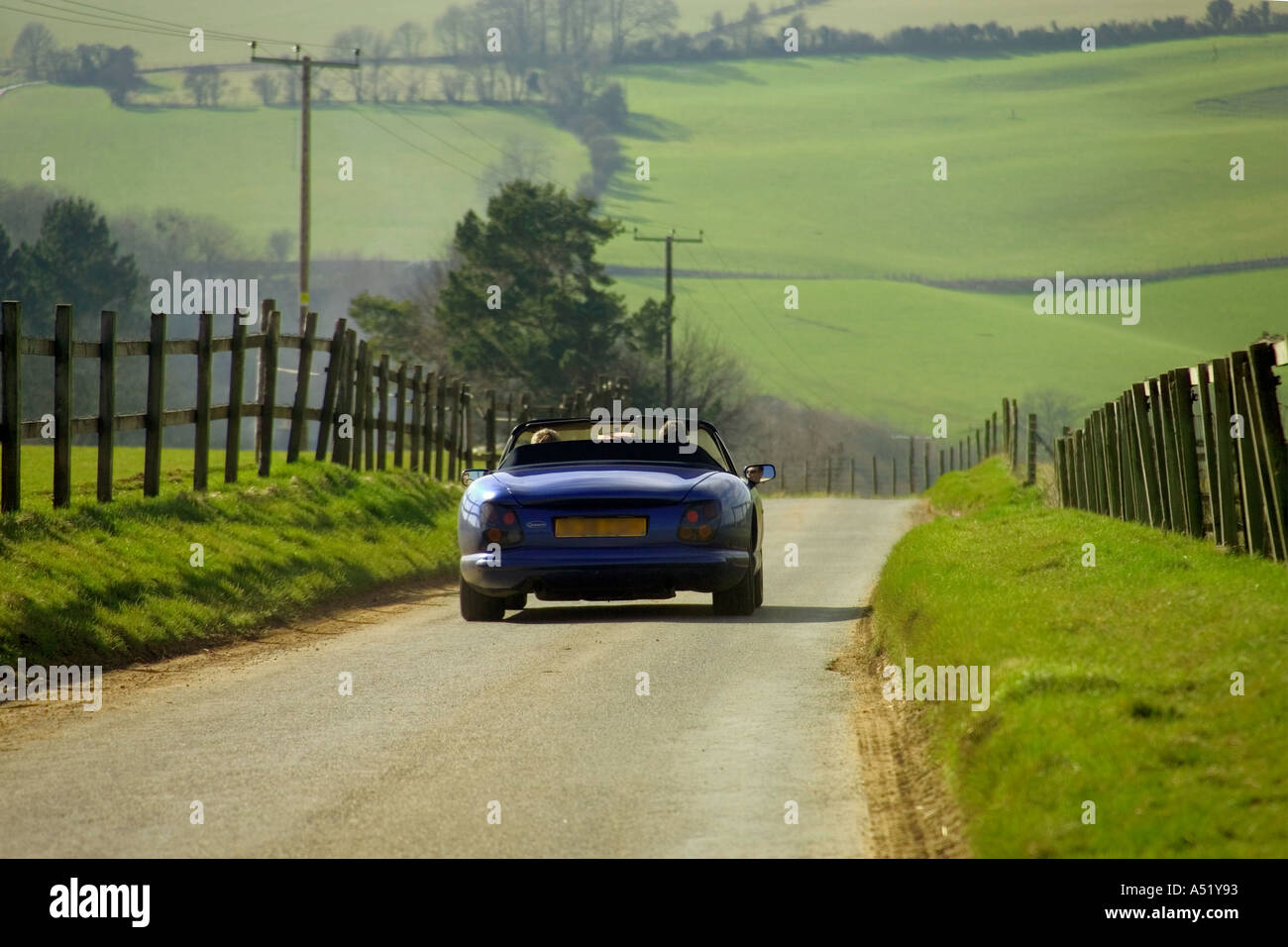 england gloucestershire the cotswolds car driving along cotswolds lane