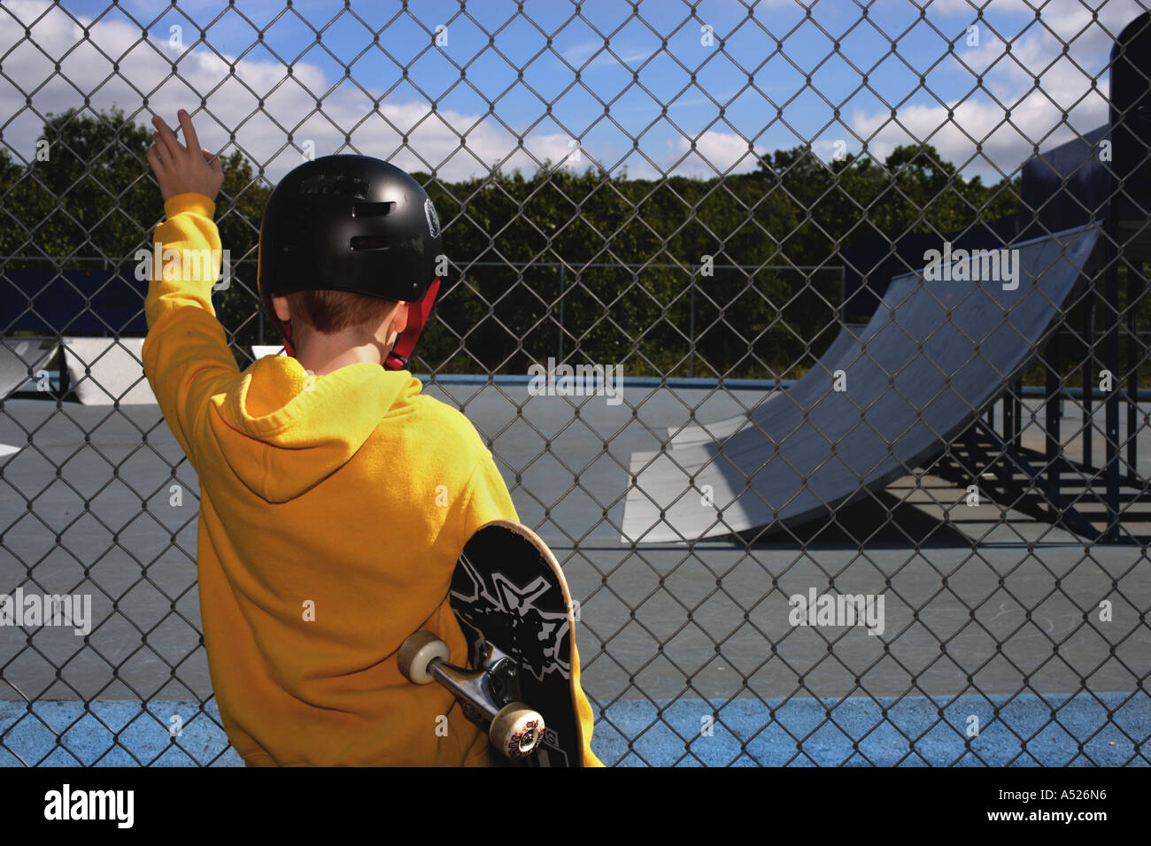 Child Contemplating Skateboard Ramp Stock Photo