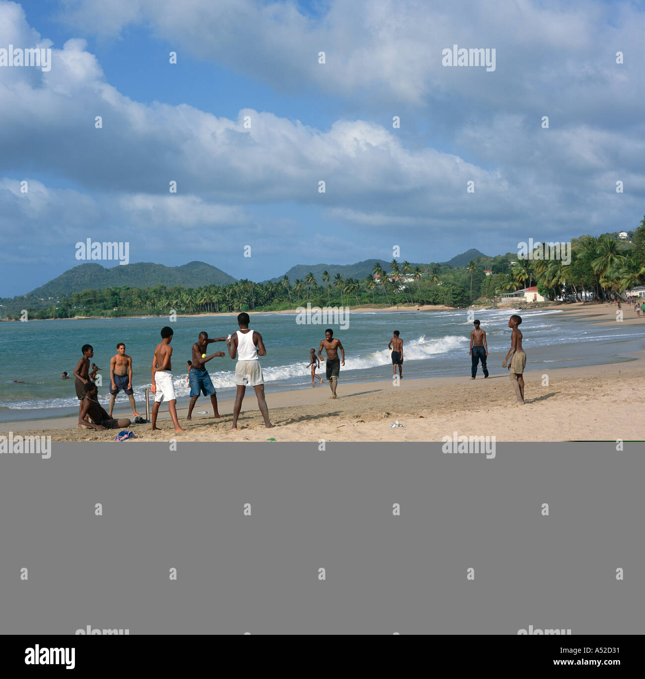 A group of local West Indian boys play a game of cricket on Vigie Beach near Castries St Lucia The Caribbean Stock Photo