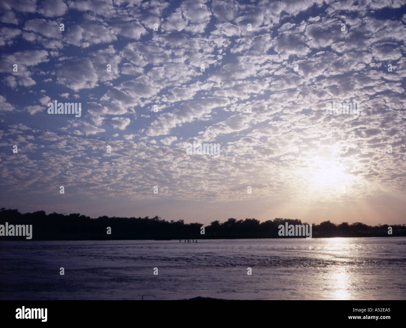 Herringbone clouds frame a river in the Chitwan National Park, Nepal