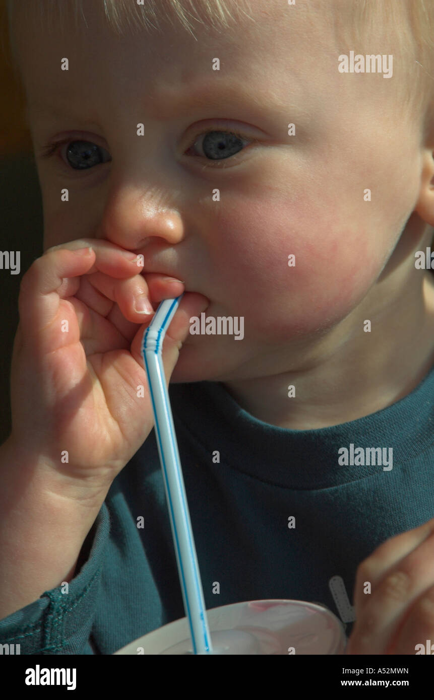 toddler drinking through straw Stock Photo Alamy