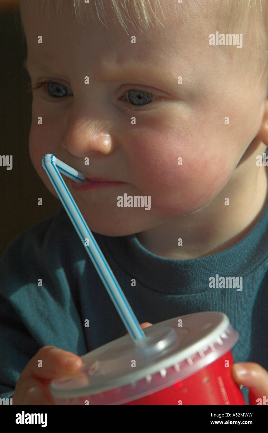 toddler drinking through straw Stock Photo Alamy