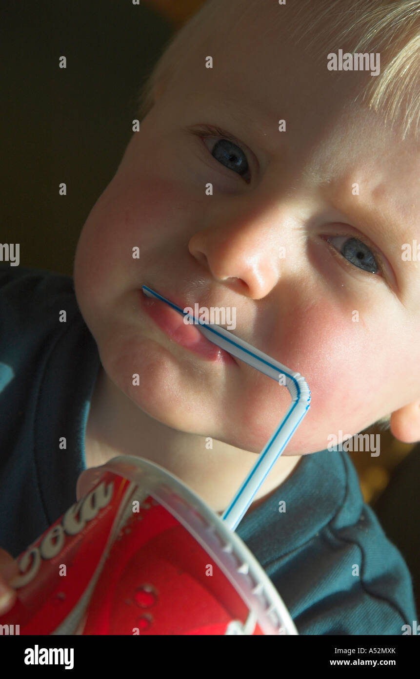 toddler drinking through straw Stock Photo Alamy