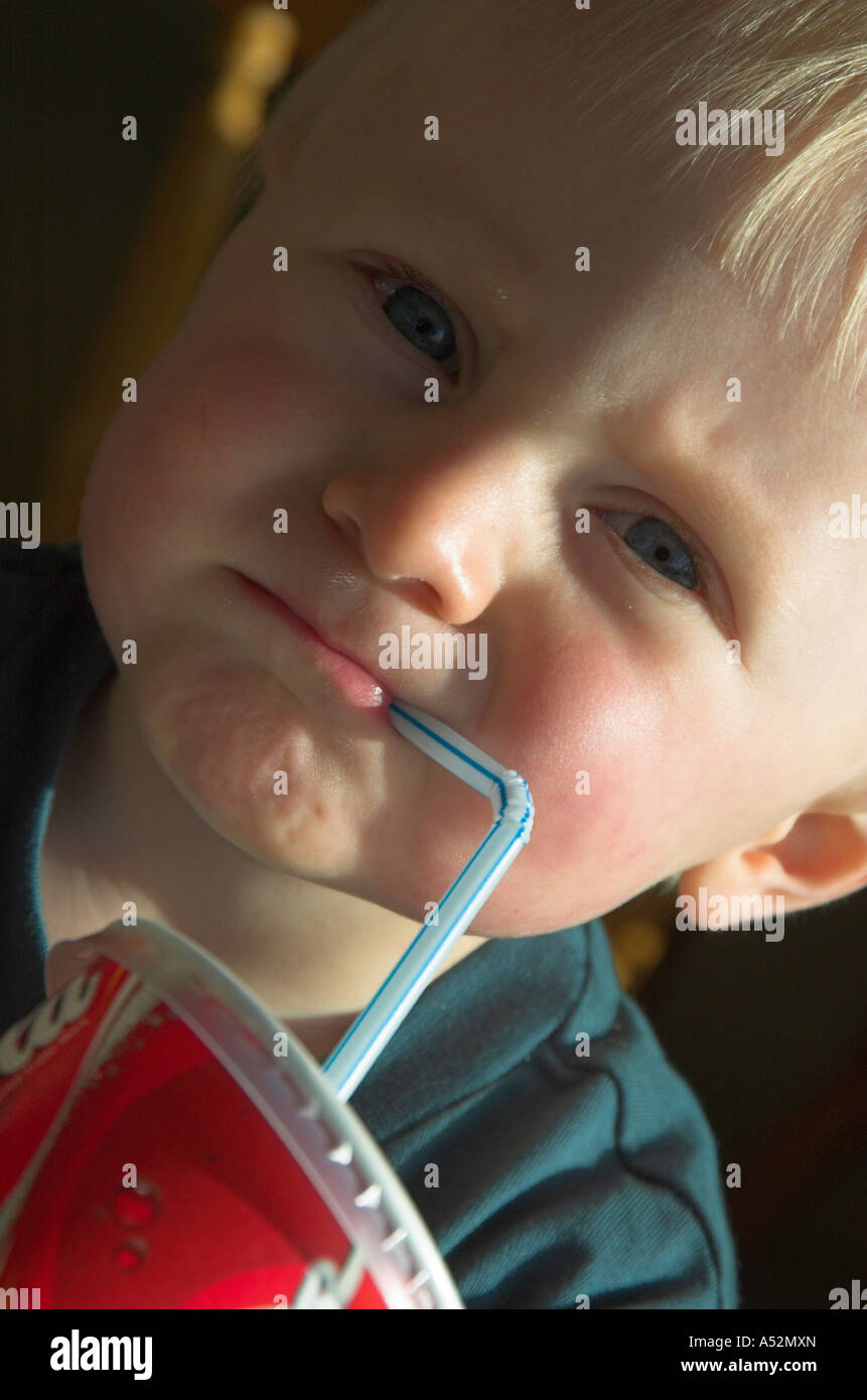 toddler drinking through straw Stock Photo Alamy