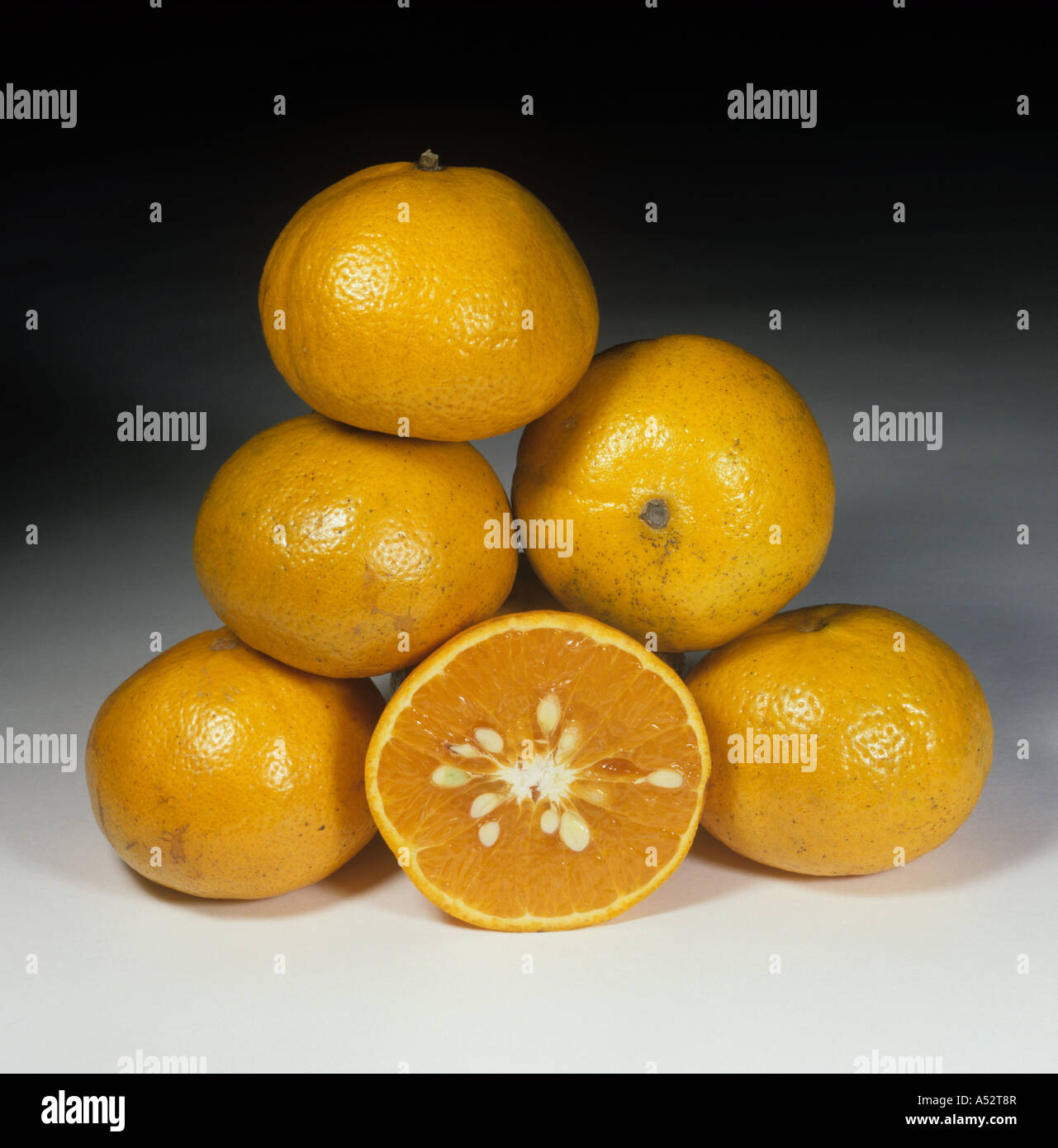 Whole sectioned tangerine fruit variety Murcott Honey Stock Photo