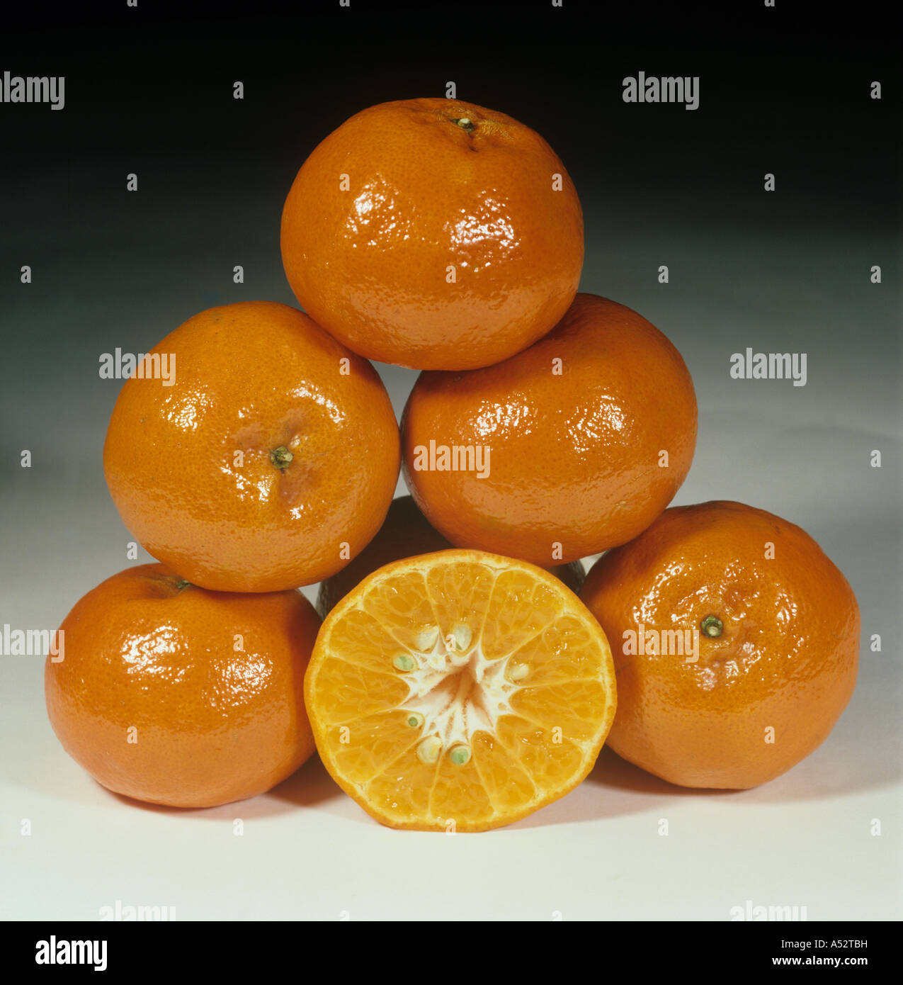 Whole and sectioned tangerine fruit variety Dancy Stock Photo