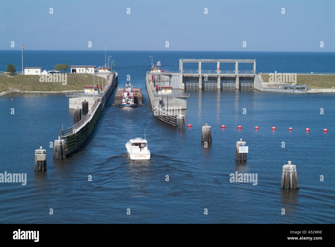 Boats pass through the Port Mayaka Lock on Lake Okeechobee from the Saint Lucie Canal Stock Photo