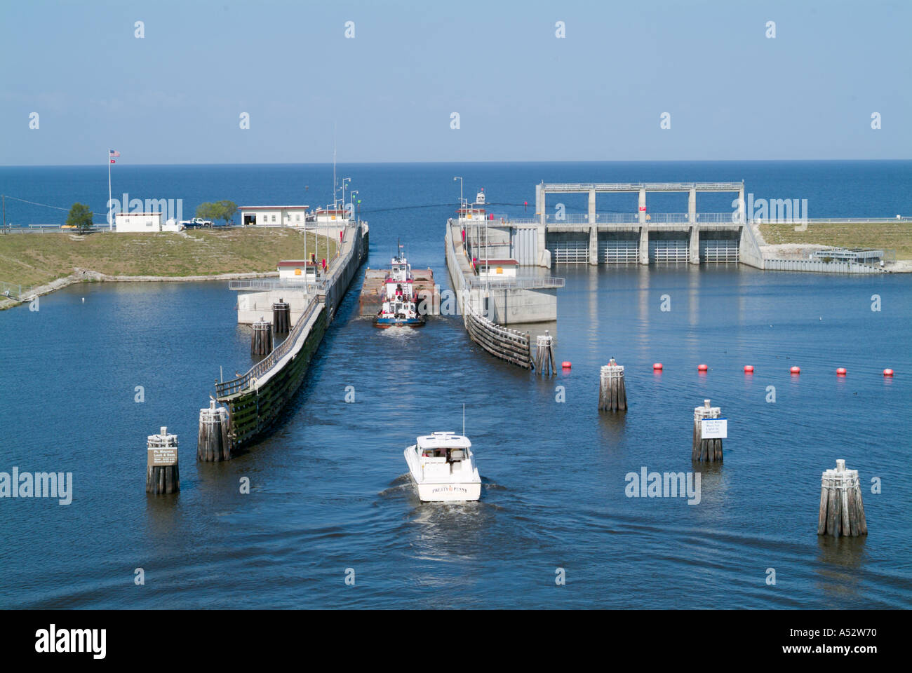 Boats pass through the Port Mayaka Lock on Lake Okeechobee from the Saint Lucie Canal Stock Photo