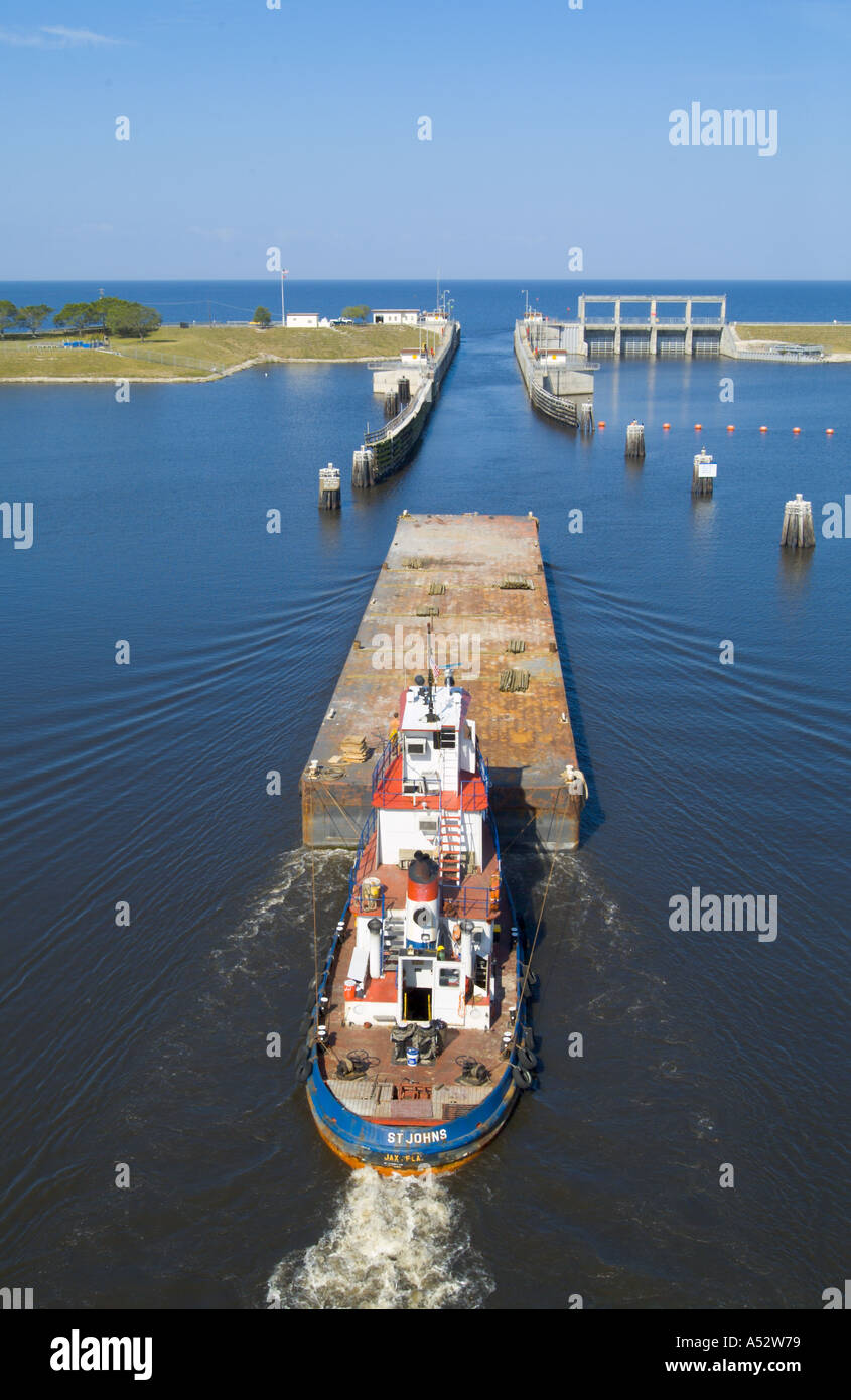 barge entering the Port Mayaka Lock on Lake Okeechobee from the Saint Lucie Canal Stock Photo