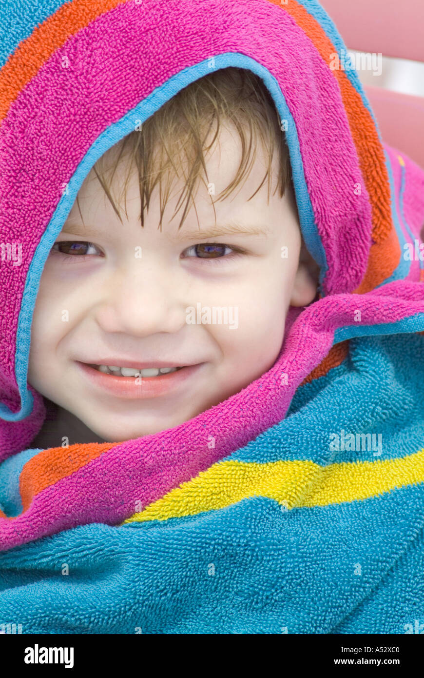 boy wrapped in towel wet drying off cute child children smile smileing