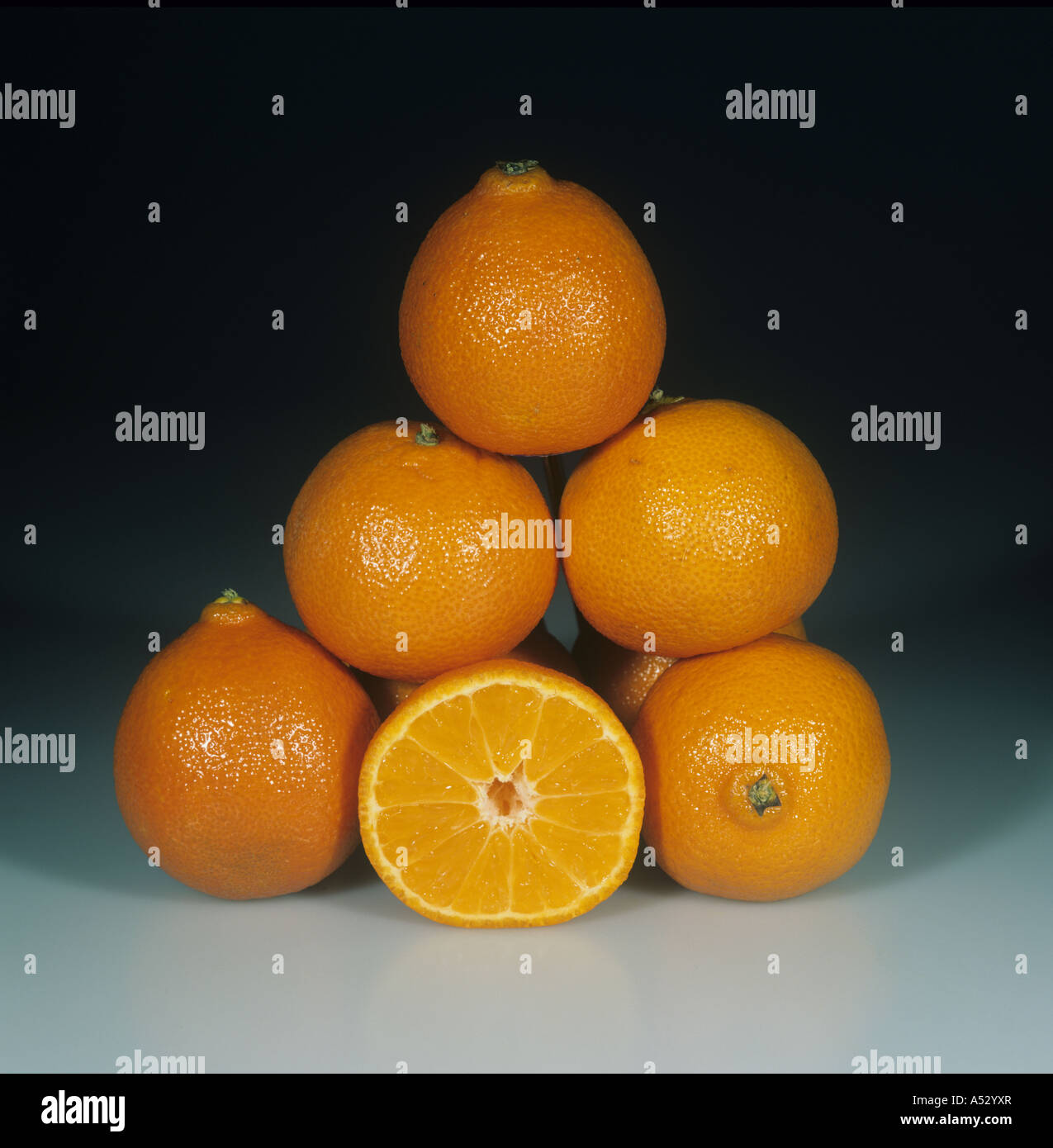Whole sectioned clementine fruit variety Nour Stock Photo