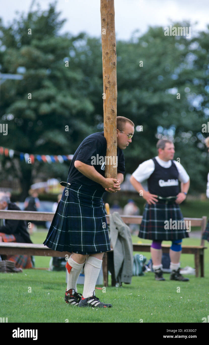 Tossing the caber at Highland Games at Ballater Scotland Stock Photo