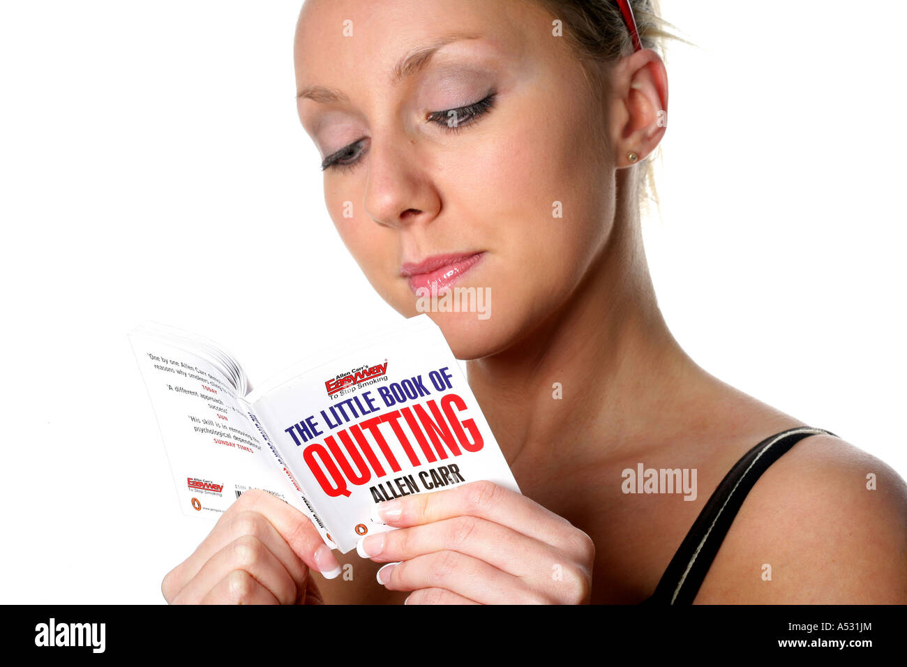 Young Woman Reading Quitting Smoking Book Model Released Stock Photo