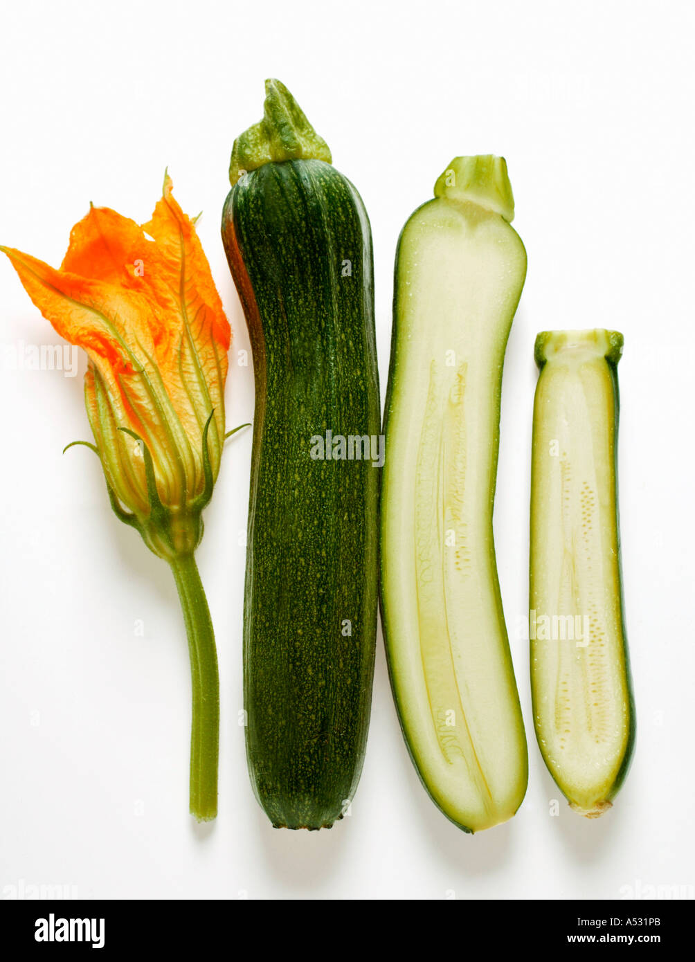 Courgette flower whole and half courgettes Stock Photo Alamy