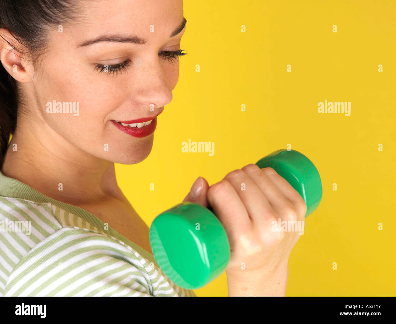 Young Woman Lifting Weights Model Released Stock Photo - Alamy