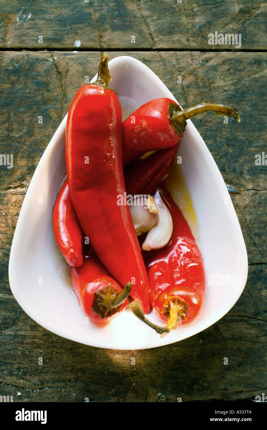 Pickled red chili peppers Stock Photo - Alamy