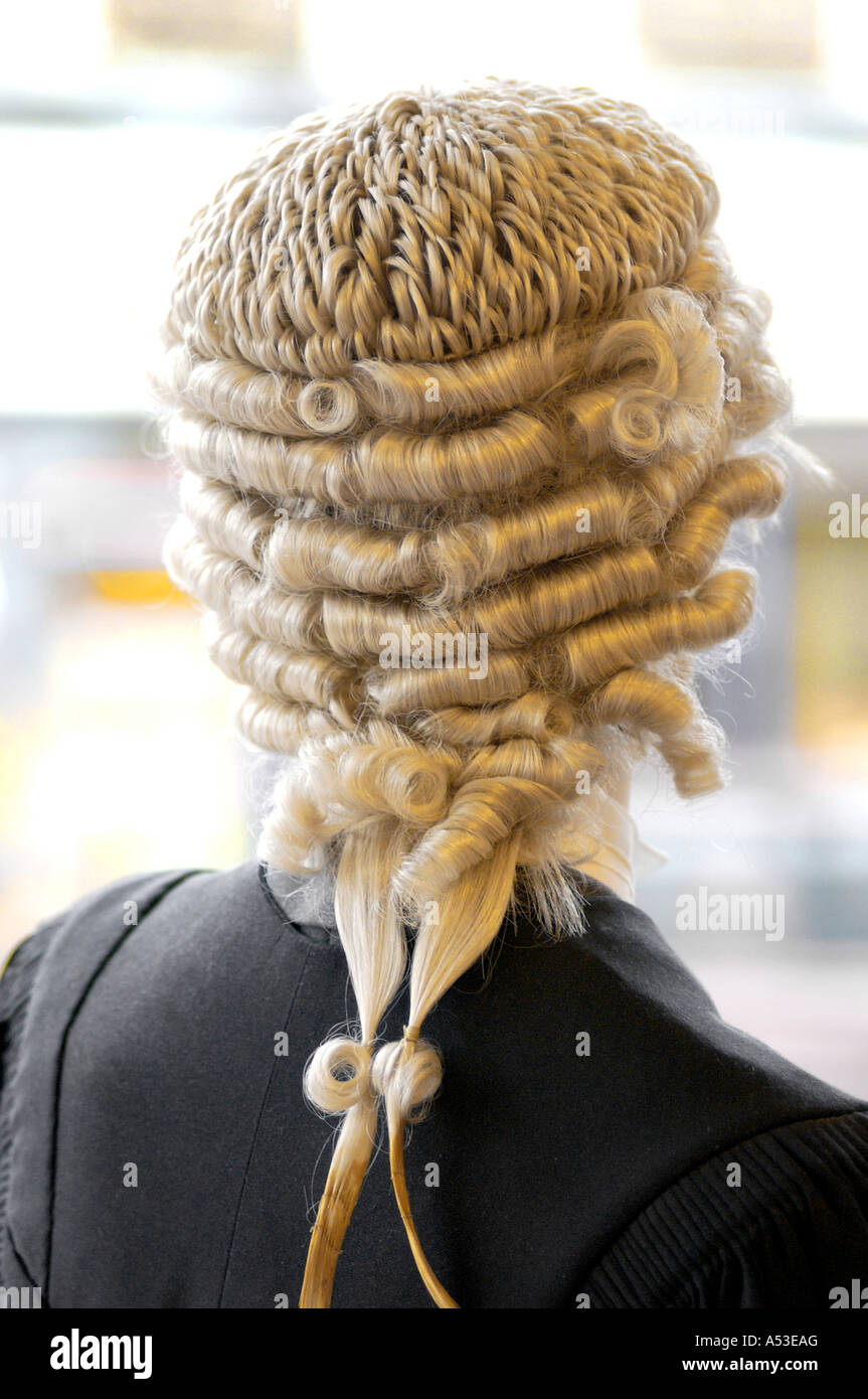 British judge with wig standing and thinking in high court London UK Stock Photo