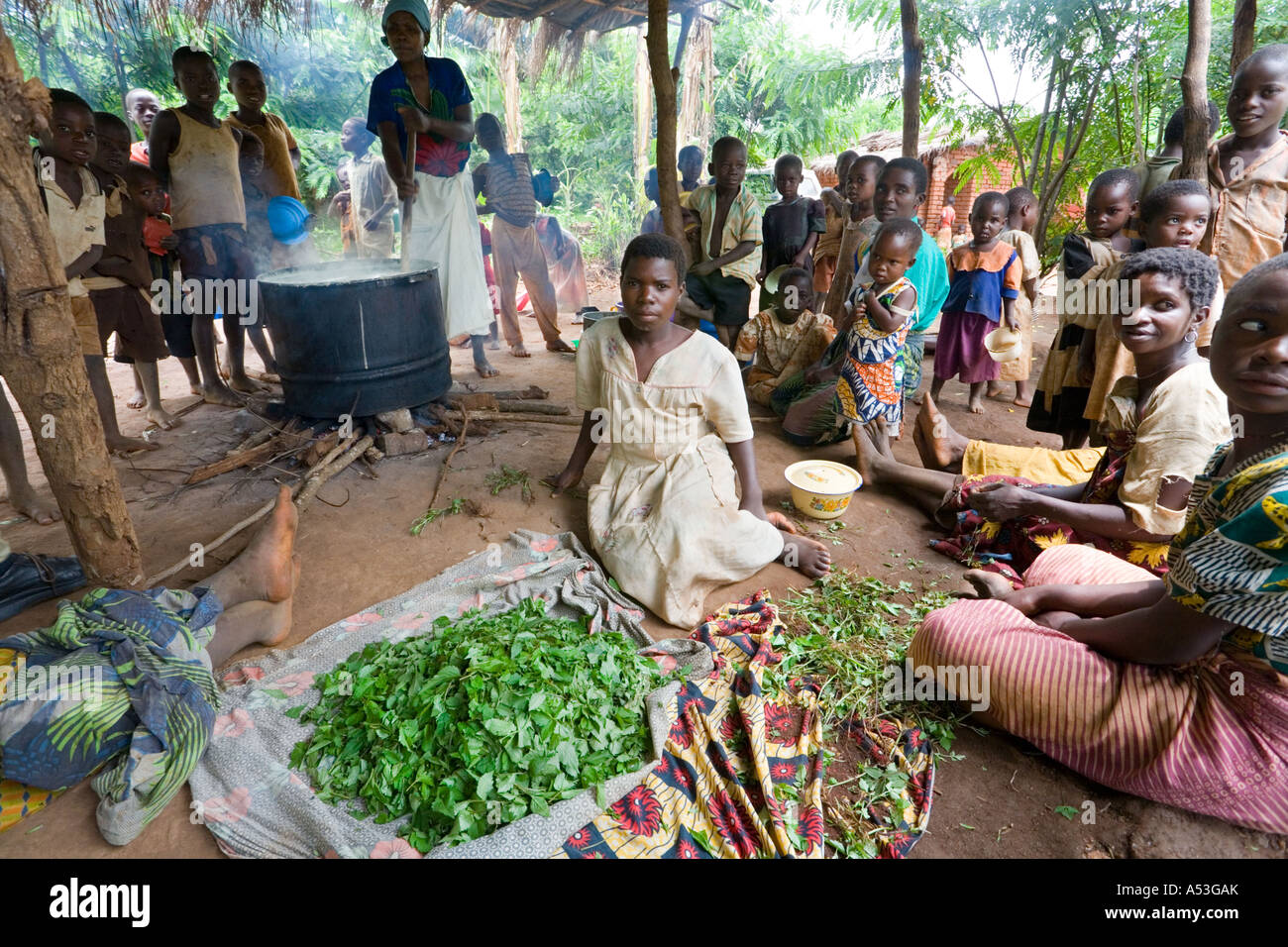 Cooking phala as part of the Joseph Project feeding programme in the village of Lombwa, Malawi, Africa Stock Photo