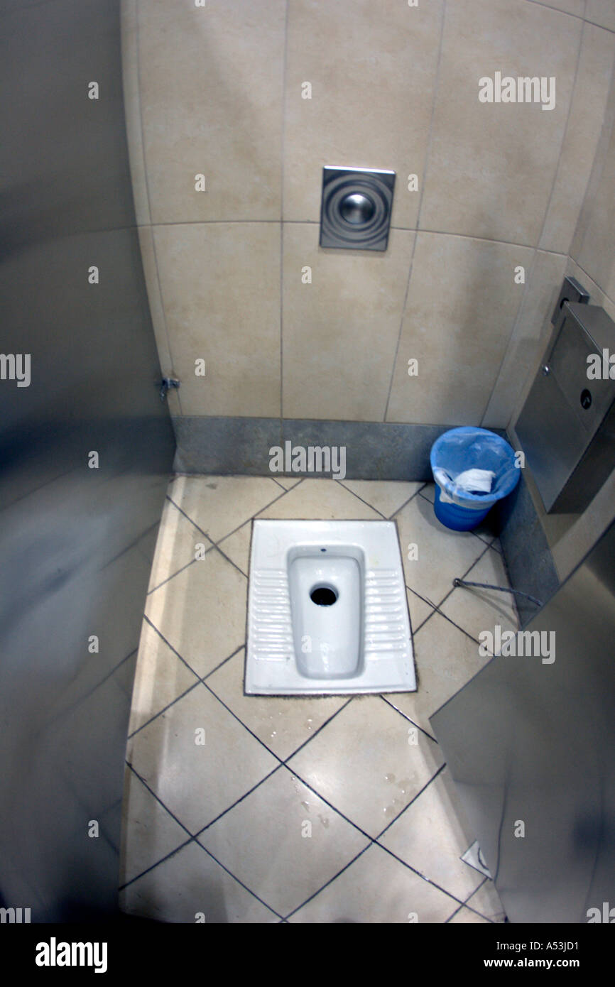 JORDAN AMMAN Middle Eastern squat toilet in the Queen Alia International  Airport Stock Photo - Alamy