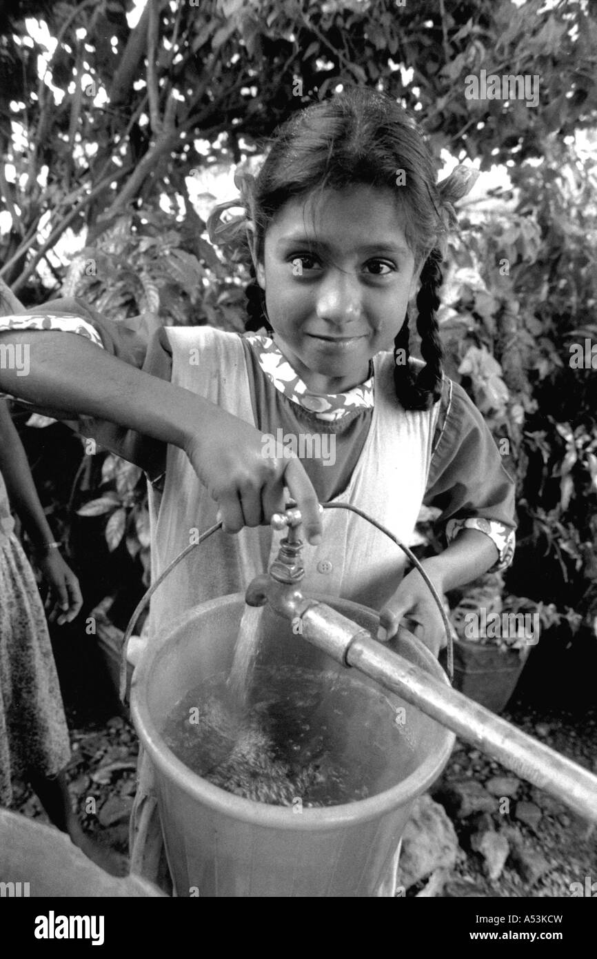 Painet ha1248 027 black and white water girl drawing tap bihar india country developing nation economically developed Stock Photo