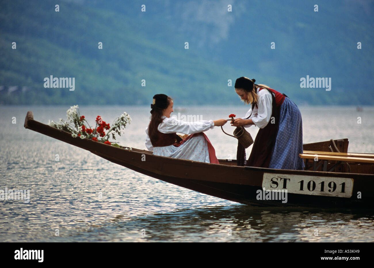 Young girls in a wooden boat traditional daffodil festival on the