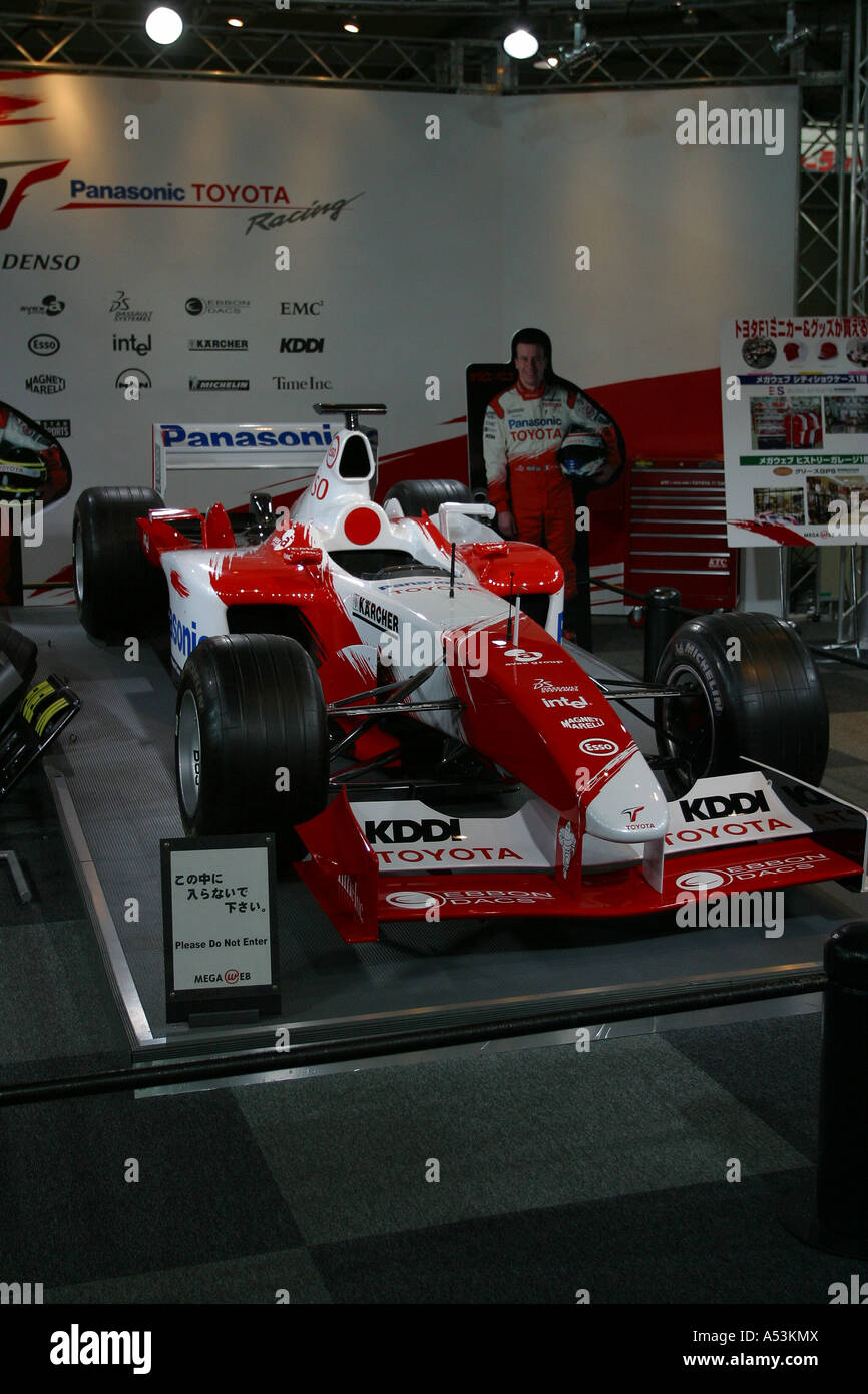 toyko japan travel car show room racer radge F1 formula one red white rotate show girl light cool new last Stock Photo