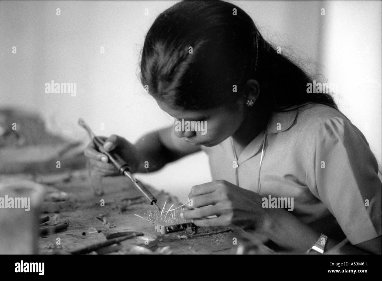 Painet ha1372 181 black and white clabor woman working electronics factory kerala india country developing nation Stock Photo